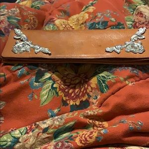 Leather embellished with ornate silver detail